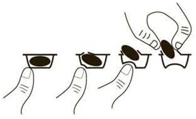 A hand holding glasses with a black oval
Description automatically generated with medium confidence