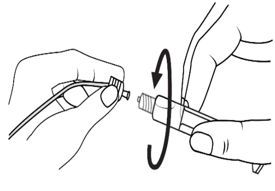 A close-up of a hand holding a plug
Description automatically generated